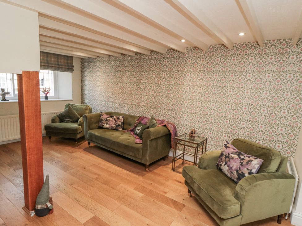 A living room with two couches and a coffee table at Inglenook Cottage in Guisborough