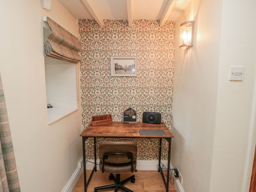 A study area with a desk and chair at Inglenook Cottage in Guisborough