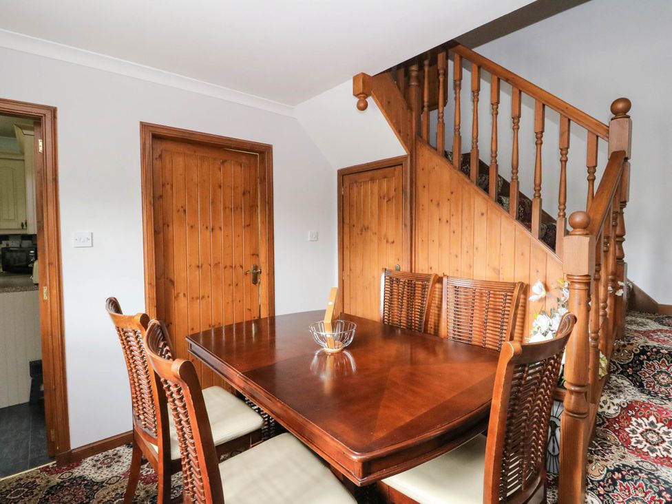 A dining room with a table and chairs at Ardlui Church in Inverarnan near Crianlarich