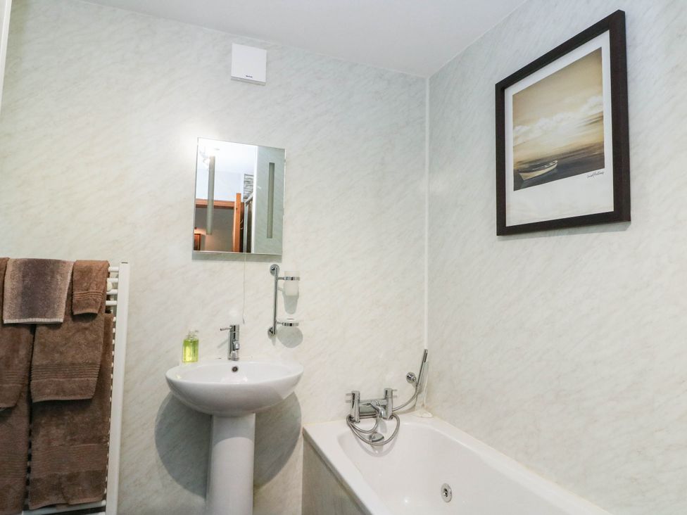 A bathroom with a sink and bath tub at Ardlui Church Inverarnan near Crianlarich
