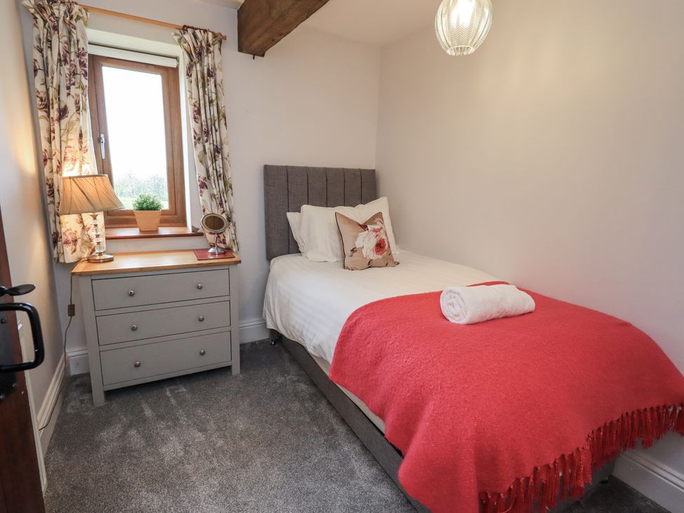 A bedroom with a single bed and a drawer at Horse and Farrier Barn in Newton in Cartmel near Cartmel