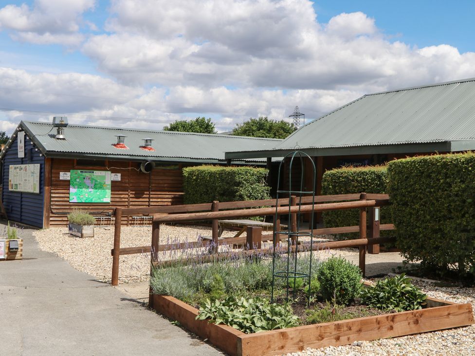 A building with a garden and path at 18 Deer Glade in Landford