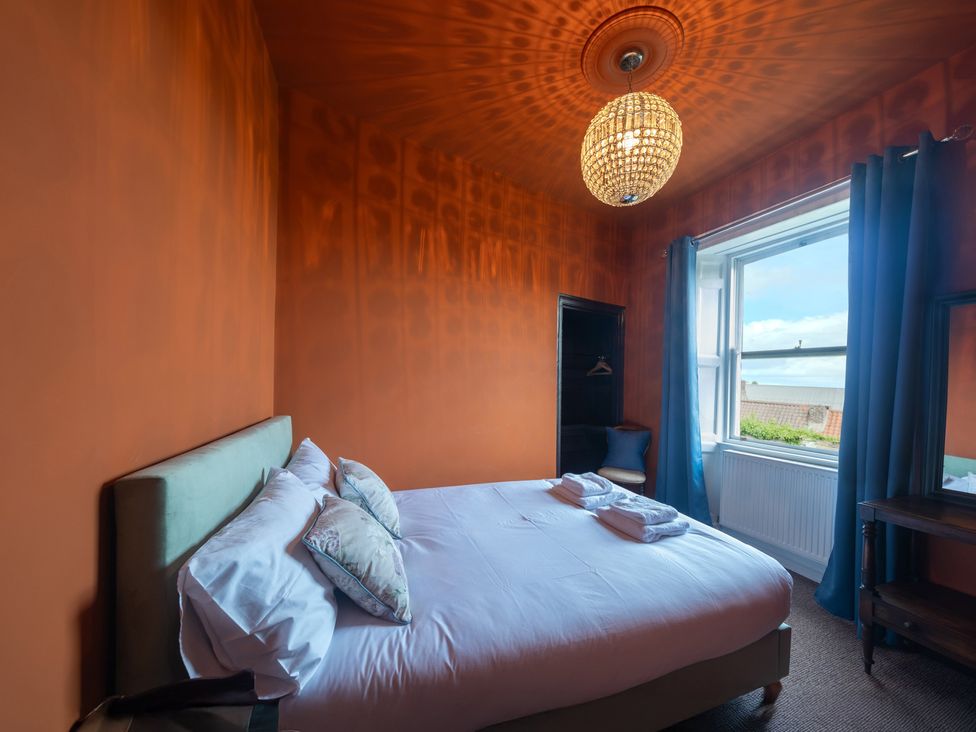 A bedroom with a bed and window at Wonderland in Tweedmouth, Berwick-Upon-Tweed