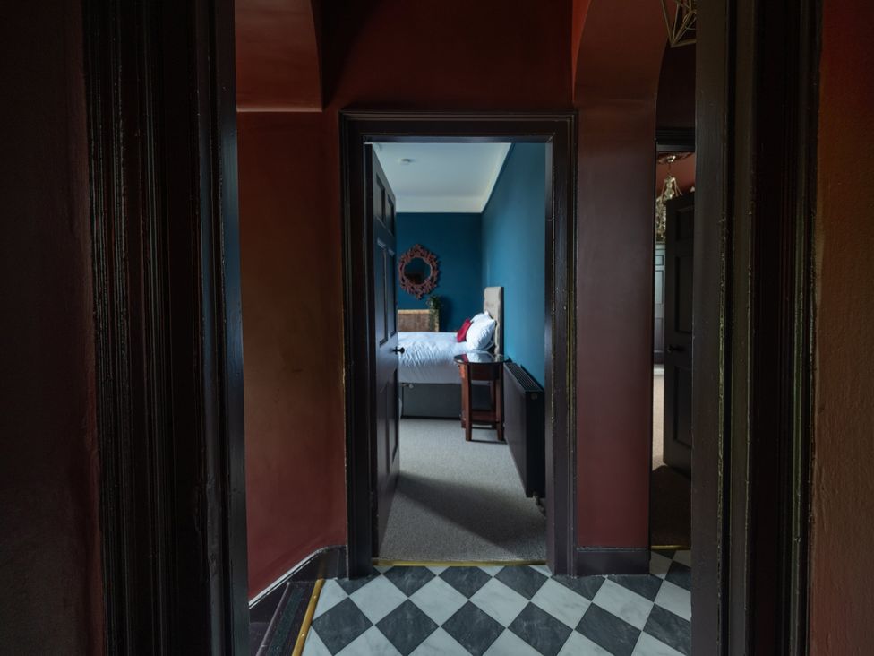 A view of a bedroom through a doorway at Wonderland in Tweedmouth, Berwick-Upon-Tweed