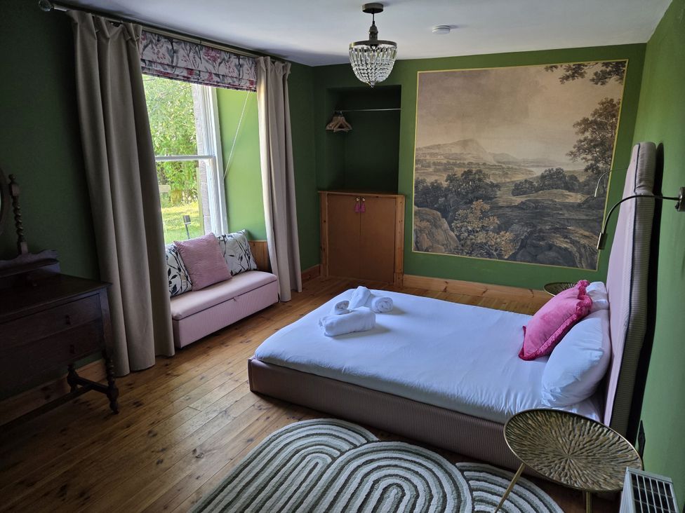 A bedroom with bed and couch at Wonderland in Tweedmouth, Berwick-Upon-Tweed