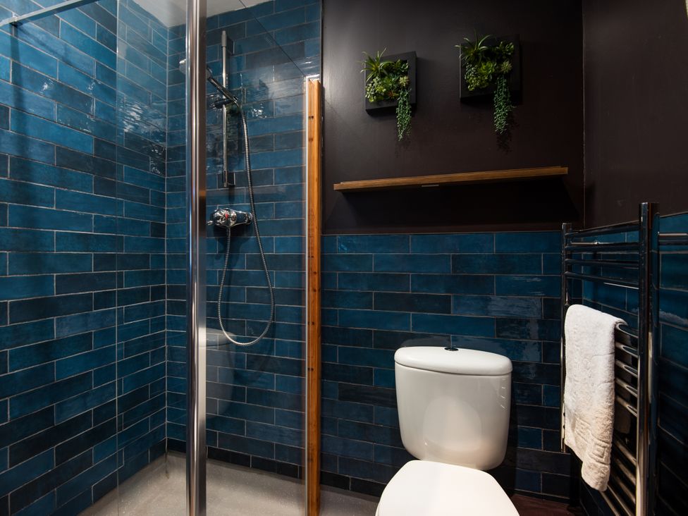 A bathroom with a shower and toilet at Wonderland in Tweedmouth, Berwick-Upon-Tweed
