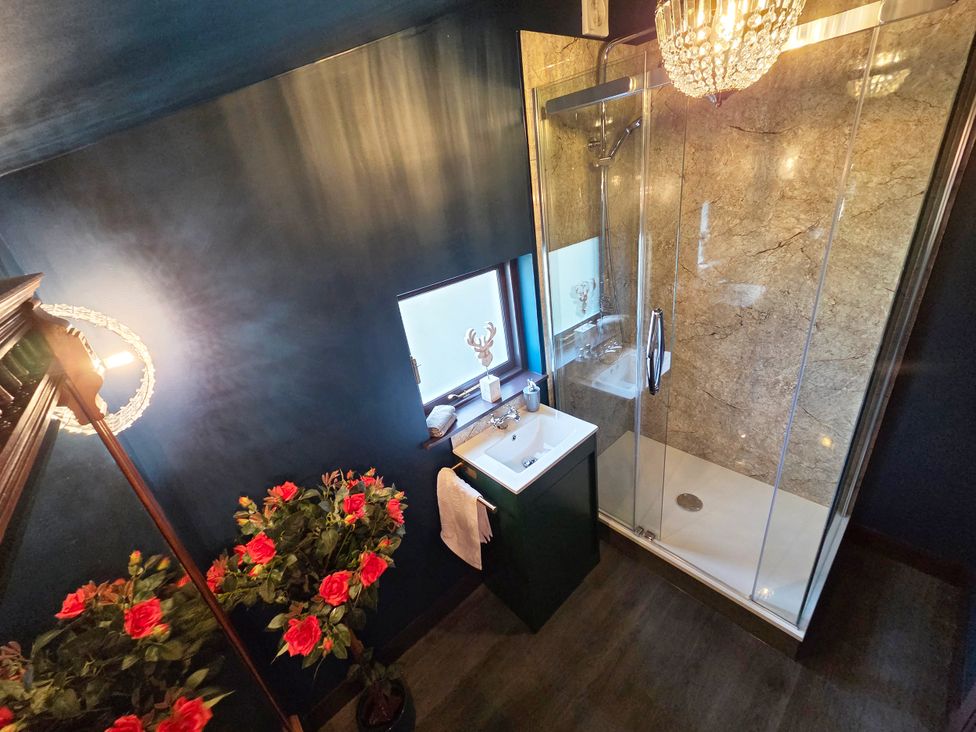 A bathroom with a shower and sink at Wonderland in Tweedmouth, Berwick-Upon-Tweed