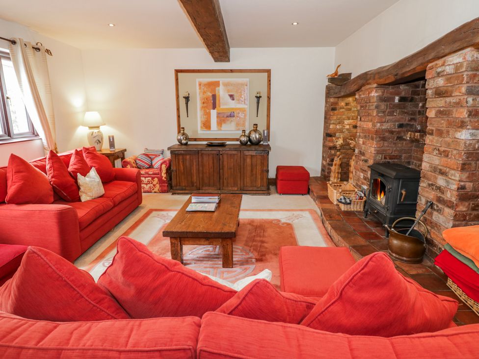 A living room with a sofa and coffee table at The Haybarn in Lichfield