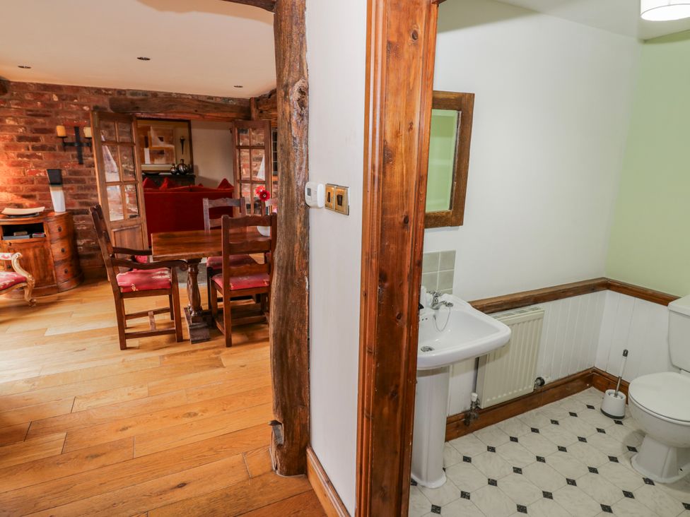 A bathroom with sink and toilet at The Haybarn in Lichfield