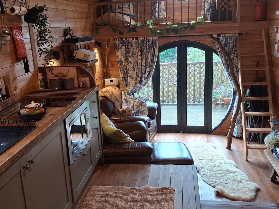 A living room with a sofa and coffee table at The Kites Nest near Pont-rhyd-y-groes, Pont-rhyd-y-groes, Snowdonia