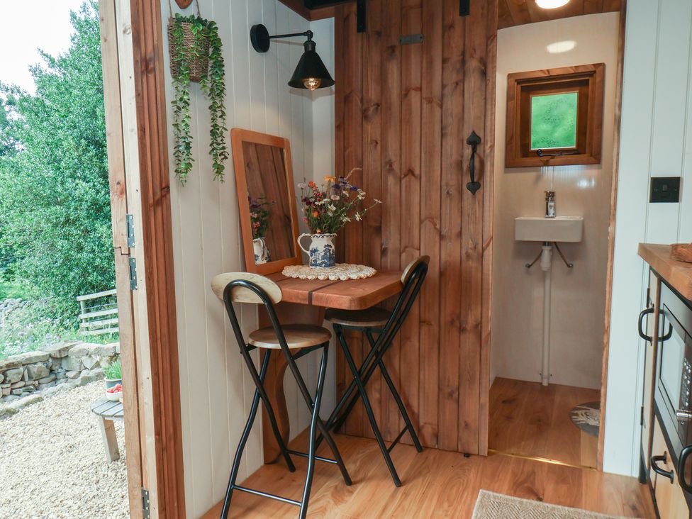 A dining area with a table and chairs at Lodge Farm in Whitby
