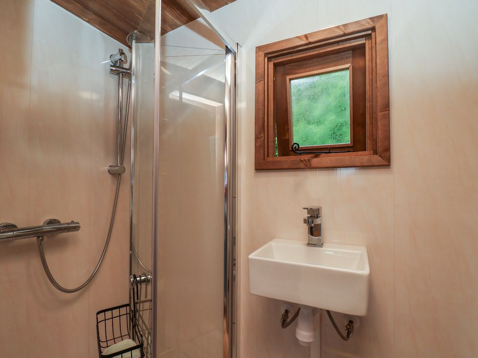 A bathroom with a shower and sink at Lodge Farm in Whitby