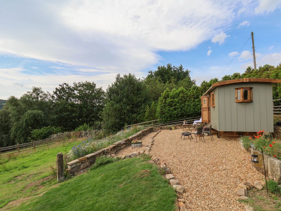 An outdoor area with a gravel path and a hut at Lodge Farm in Whitby
