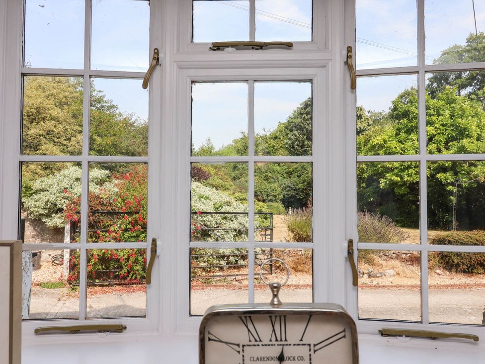 A view from a window showing a garden at The Studio Cottage near Denbigh