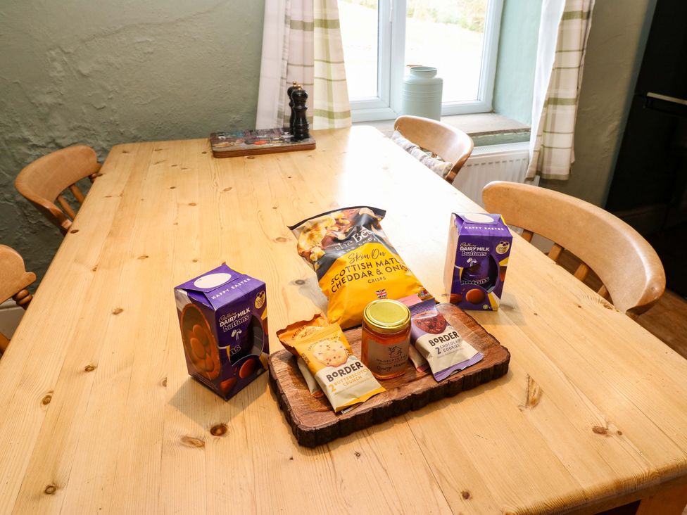 A kitchen table with snacks and a jar at The Hayloft Ellingstring near Masham