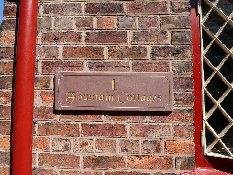 A house sign at 1 Fountain Cottages in Peckforton, Tarporley