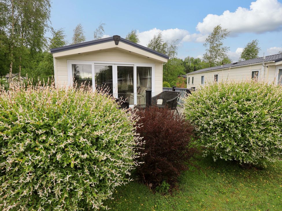A cabin with large bushes in the outdoor area at 41, Grandma's Cottage South Lakeland Leisure Village near Carnforth