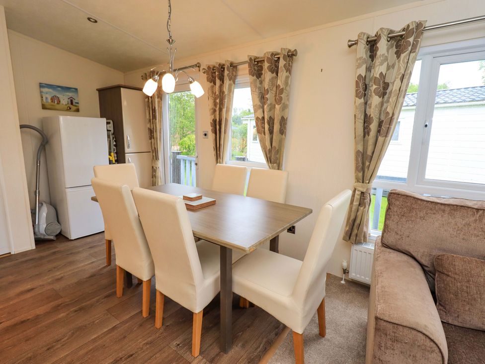 A dining area with a table and chairs at 41, Grandma's Cottage South Lakeland Leisure Village near Carnforth