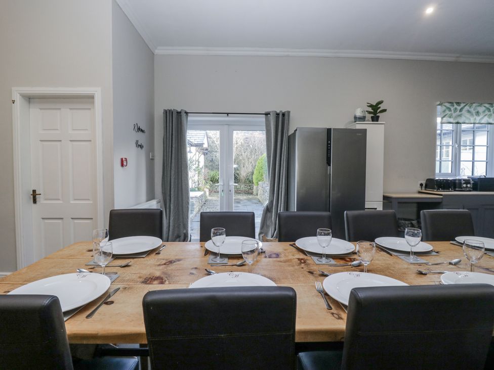 A dining room with a table set for dinner at Clarence House Dalton-In-Furness