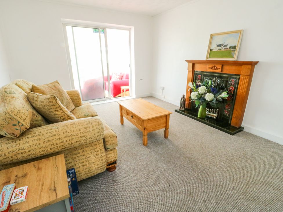 A living room with a sofa and coffee table at Pen Bonc Llanddaniel Near Gaerwen