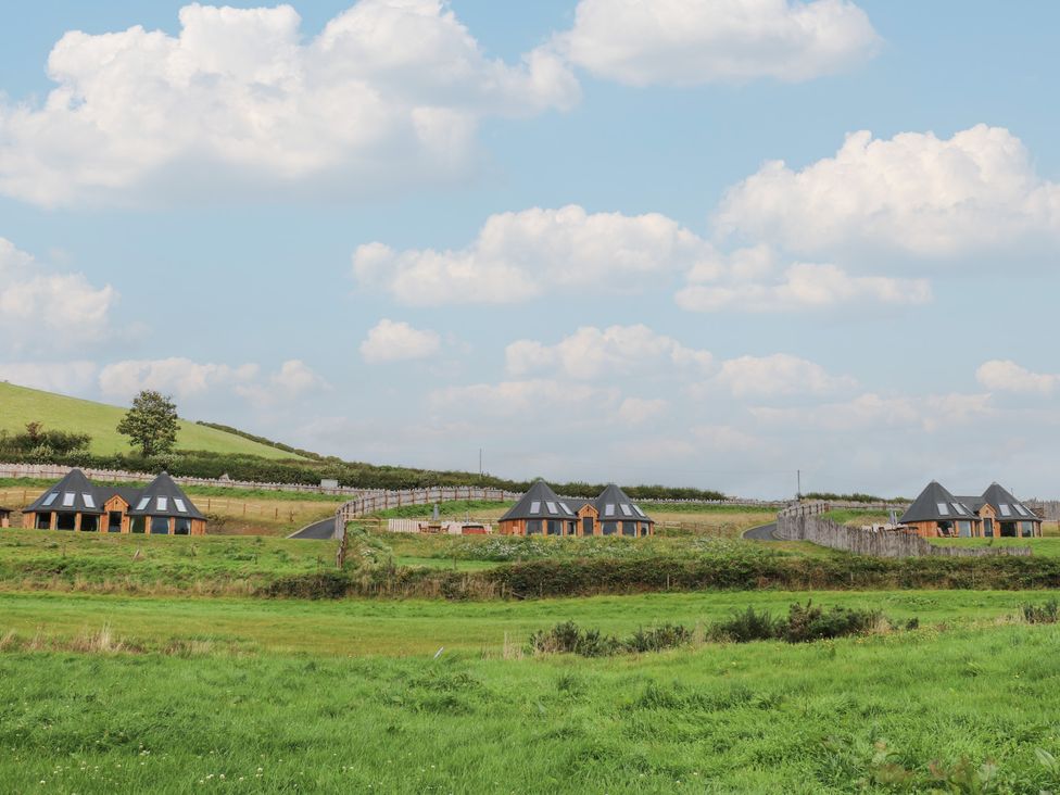 A view of several houses alongside a road in a rural area at Ty Crwn Lampeter