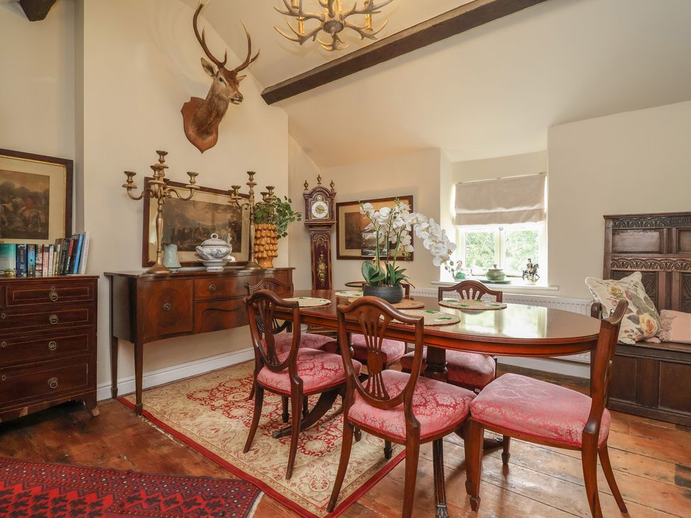 A dining room with a table and chairs at Upstairs at the White Lion