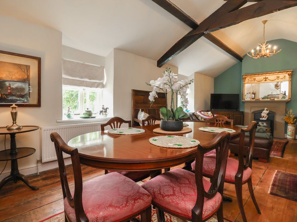 A dining room with a table and chairs at Upstairs at the White Lion 