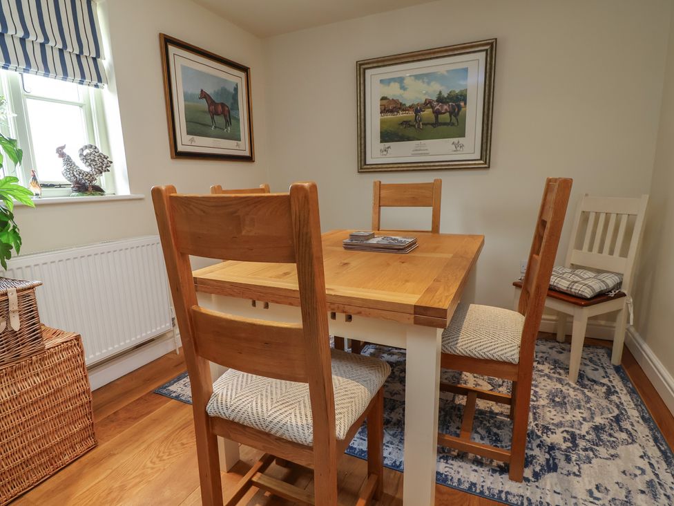 A dining room with a table and chairs at Upstairs at the White Lion