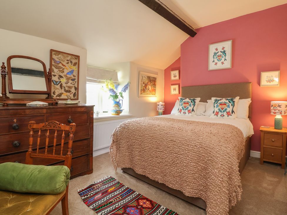 A bedroom with a bed and chest of drawers at Upstairs at the White Lion