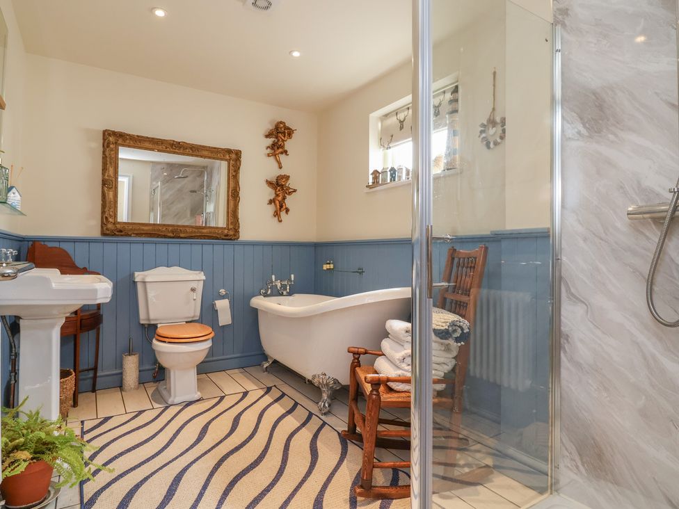 A bathroom with a bathtub and shower at Upstairs at the White Lion in 
