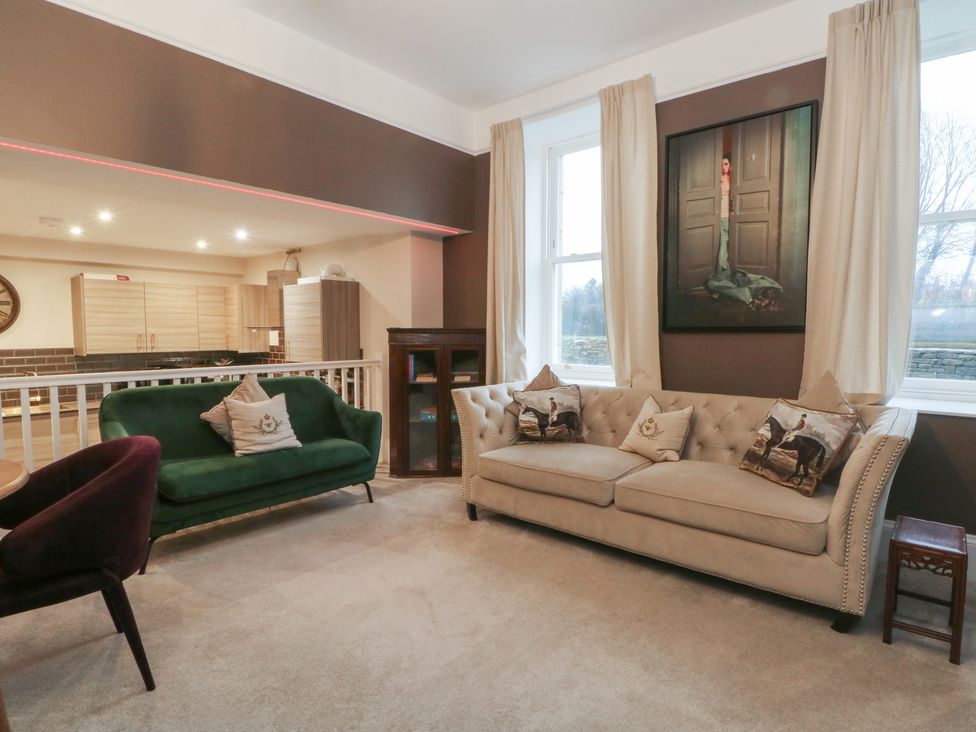 A living room featuring sofas and wall art at Lord William in Cabus near Garstang