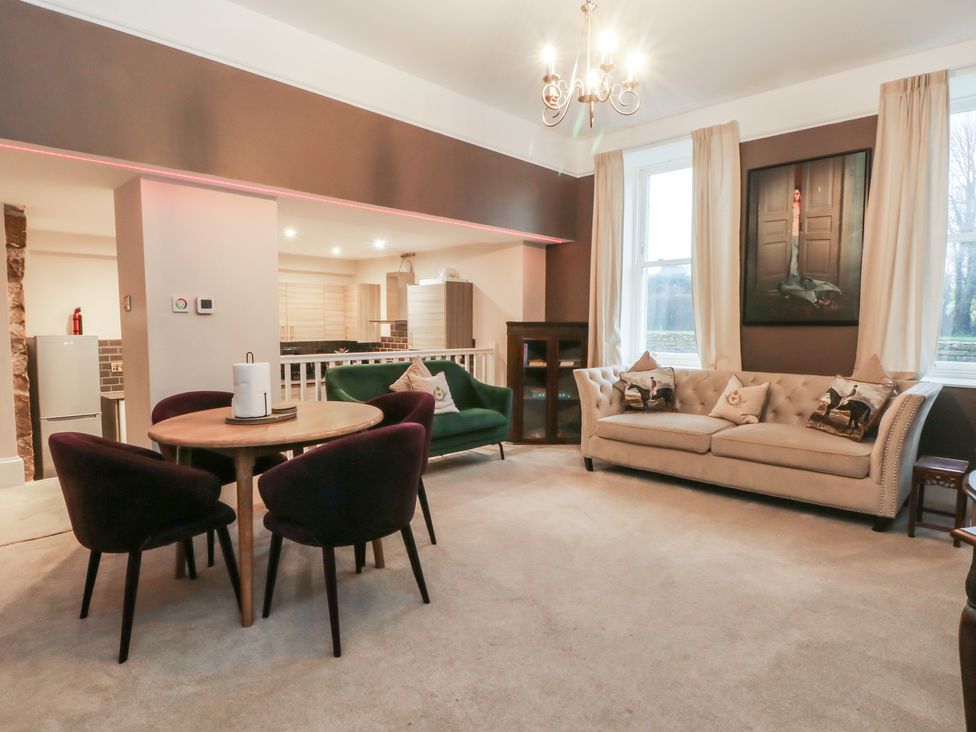 A living room with a sofa and dining table at Lord William Cabus near Garstang