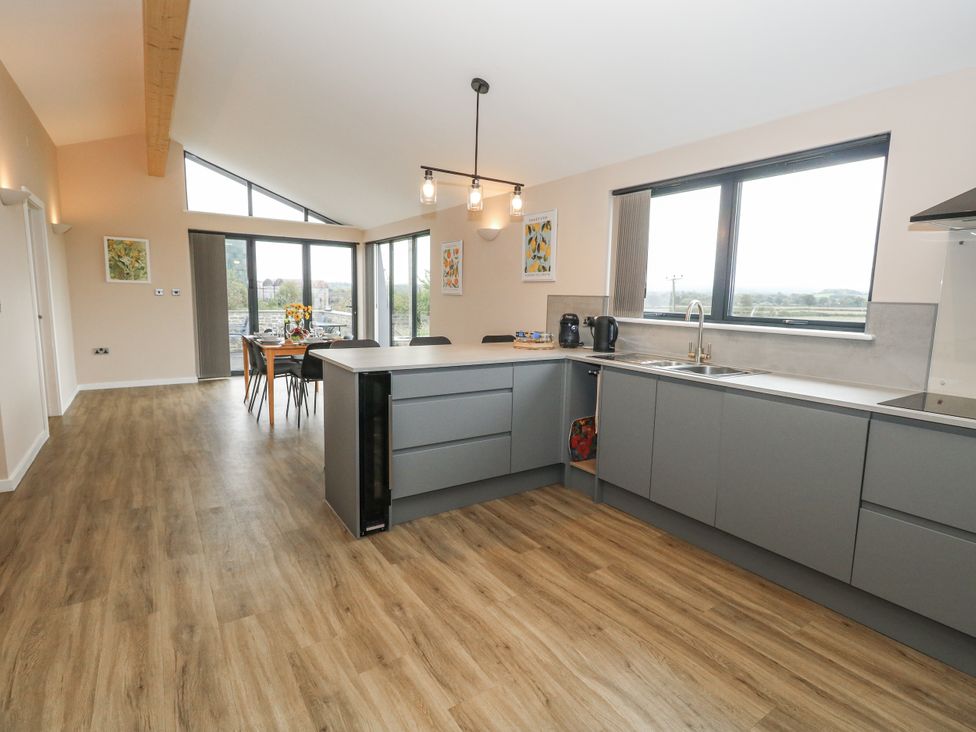 A kitchen with a dining table and chairs at Frogwell in Yetminster