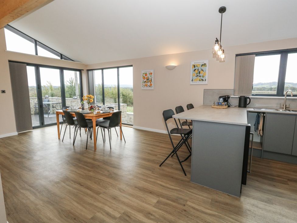 A kitchen with table and chairs at Frogwell in Yetminster