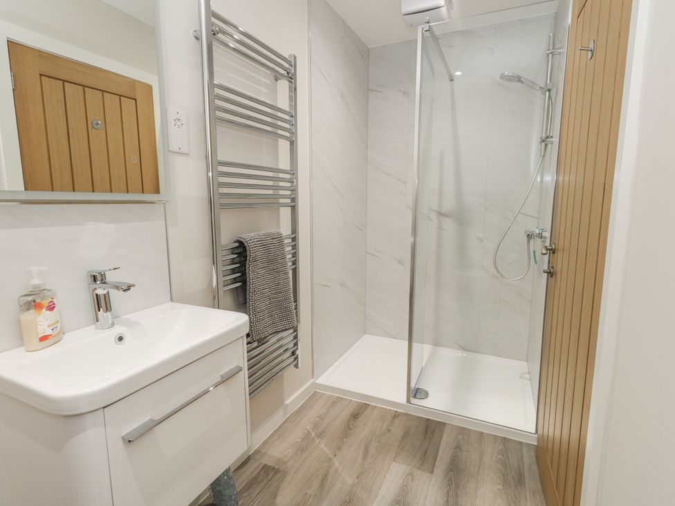 A bathroom with a shower and vanity sink at Frogwell in Yetminster