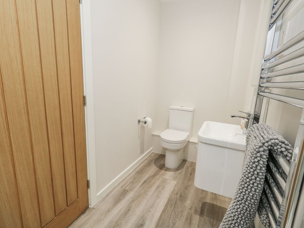 A bathroom with a toilet and wash basin at Frogwell in Yetminster