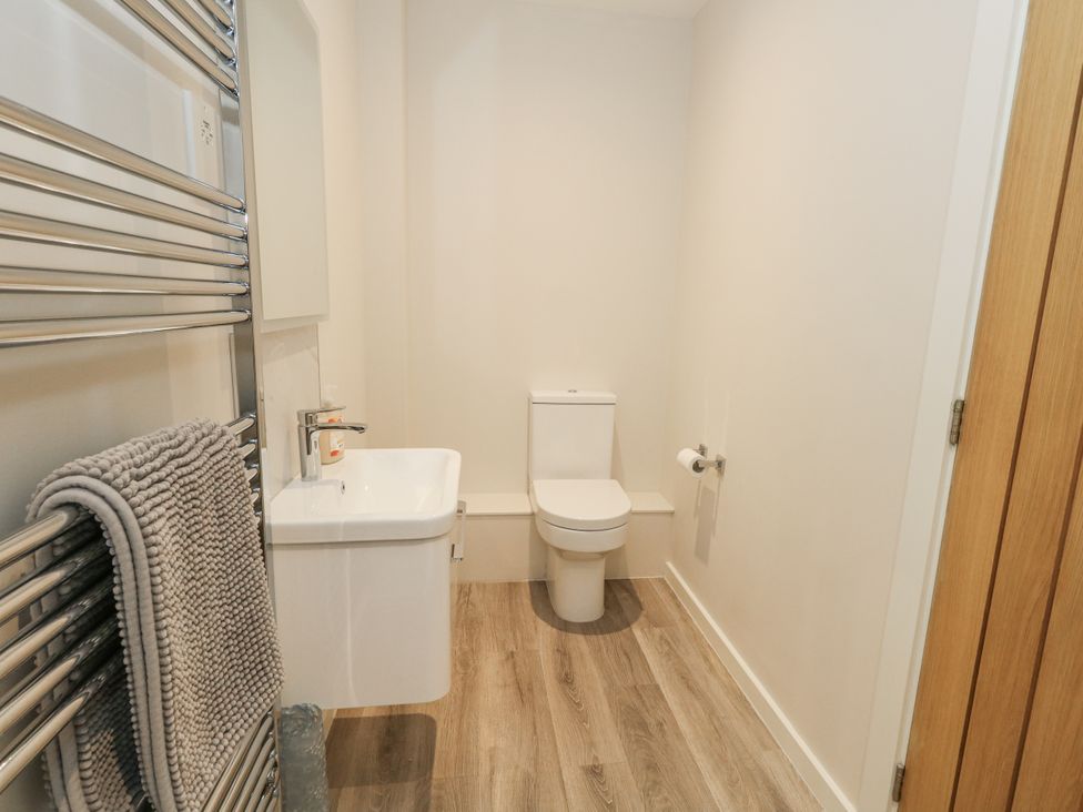 A bathroom with a toilet and sink at Frogwell in Yetminster