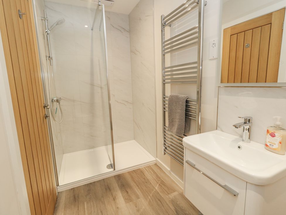 A bathroom with a shower and sink at Frogwell in Yetminster