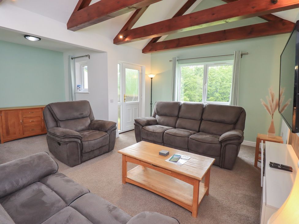 A living room with sofas and a coffee table at Whitbarrow 24 in Penruddock