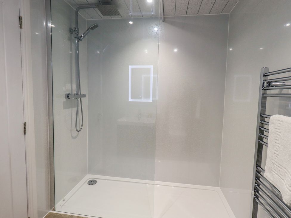 A shower with a glass enclosure in Whitbarrow 24 Penruddock