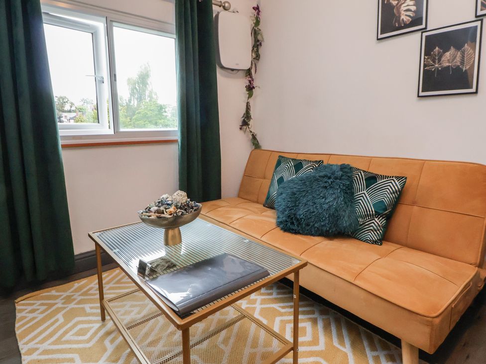 A living room with a sofa and coffee table at The Cloud Apartment 1 in Chester
