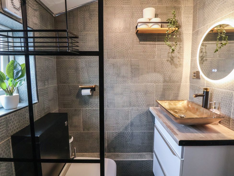 A bathroom with a bowl sink and a mirror at The Cloud Apartment 1 Chester