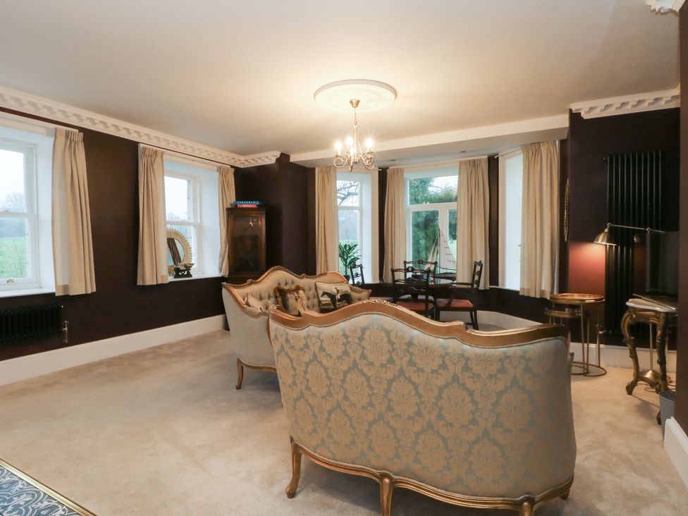 A living room with sofa and chairs at Alexander in Cabus near Garstang