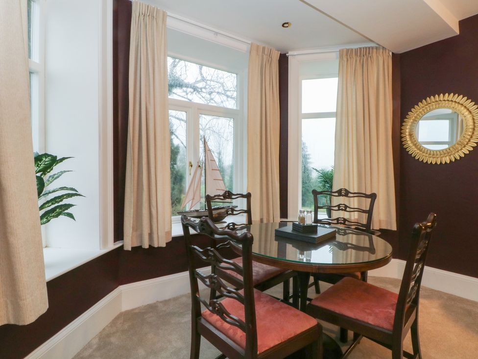 A dining room with a table and chairs at Alexander Cabus near Garstang