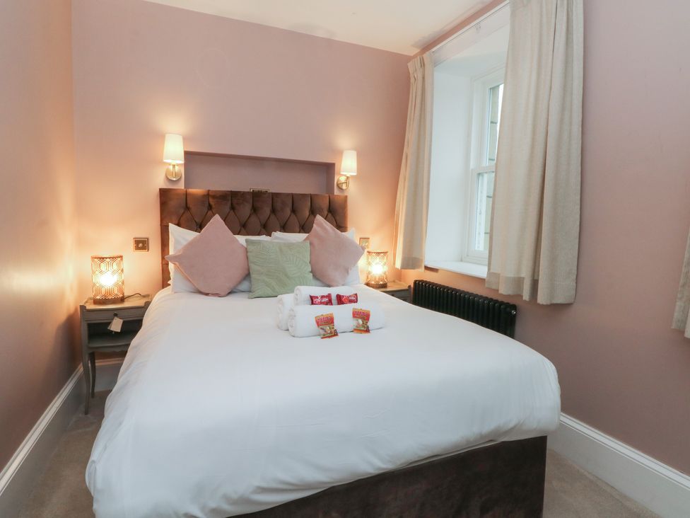 A bedroom with a bed and nightstand at Alexander in Cabus near Garstang