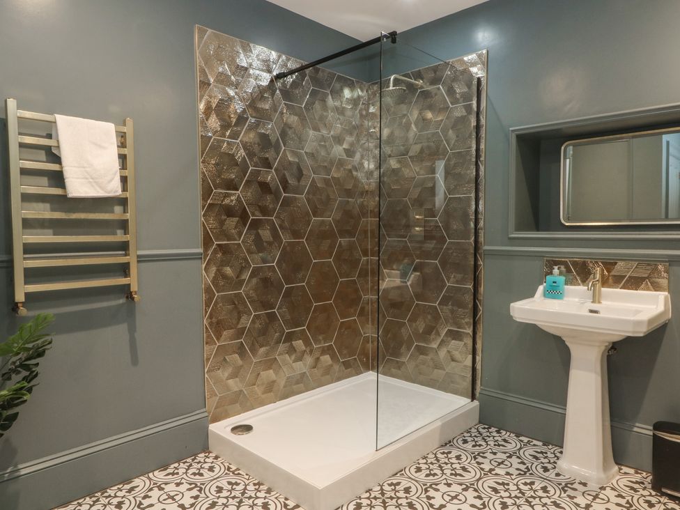 A bathroom with a shower and sink at Alexander in Cabus near Garstang