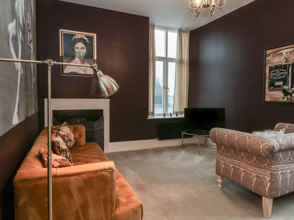 A living room with a sofa and TV at The Hyde Cabus near Garstang