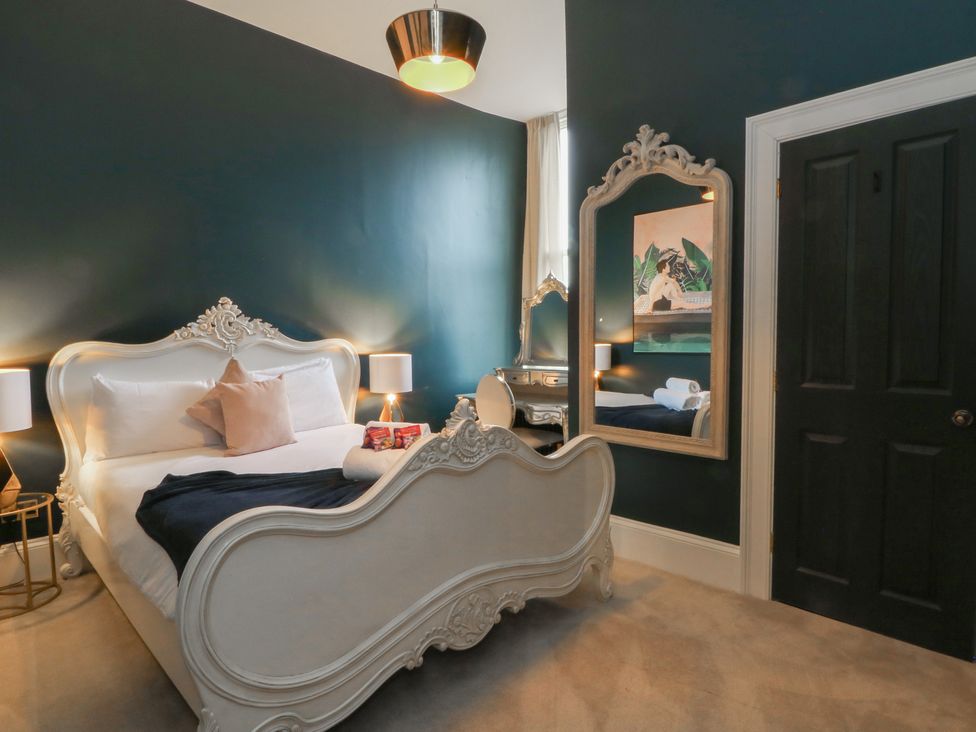 A bedroom with a bed and mirror at The Hyde in Cabus near Garstang