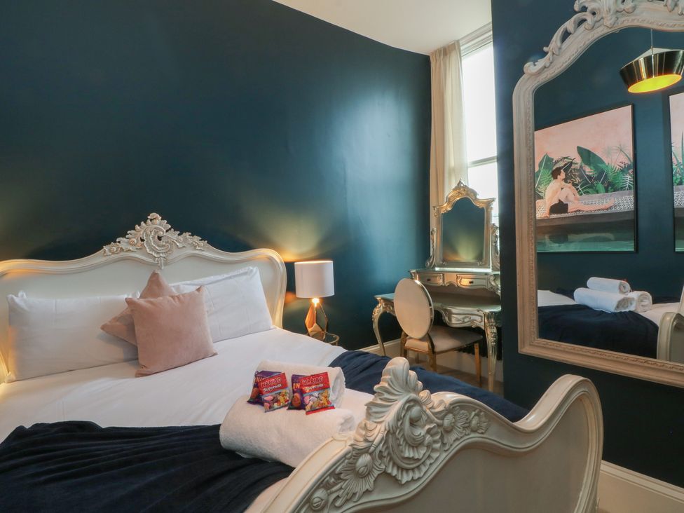 A bedroom with a bed and dressing table at The Hyde in Cabus near Garstang