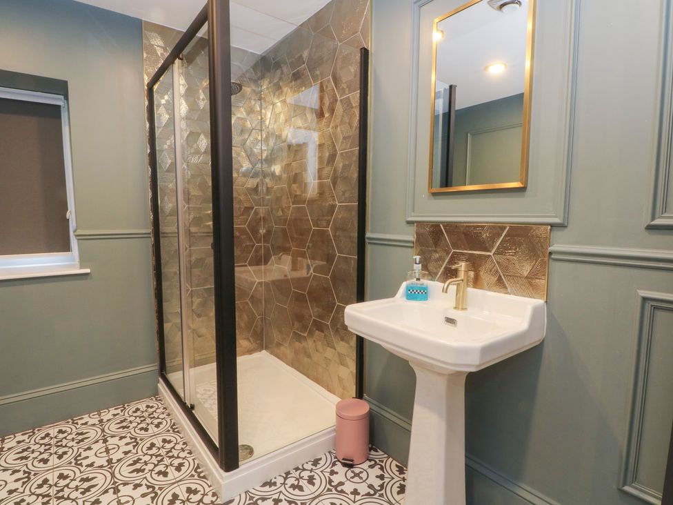 A bathroom with a shower and sink at The Hyde in Cabus near Garstang
